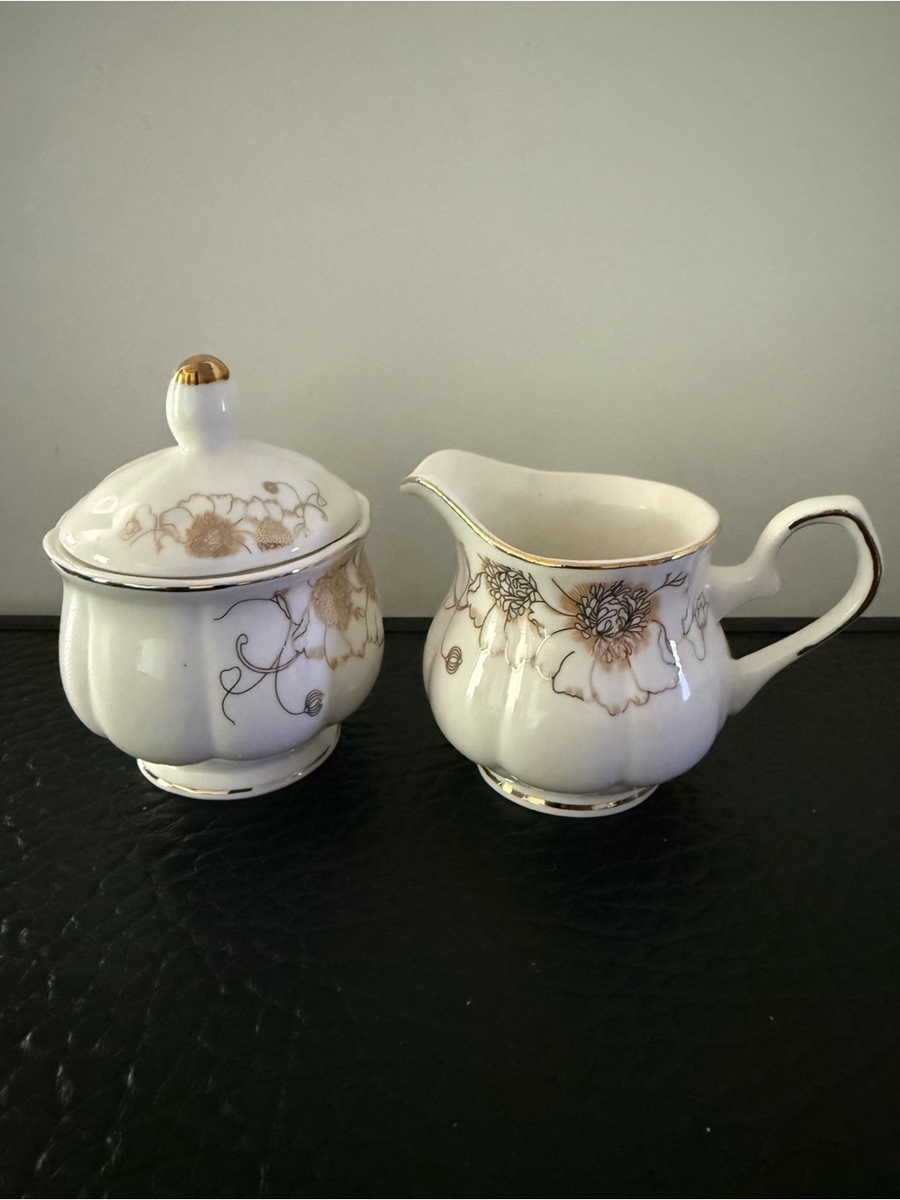 White Porcelain Creamer and Sugar Set with Gold Floral Accents